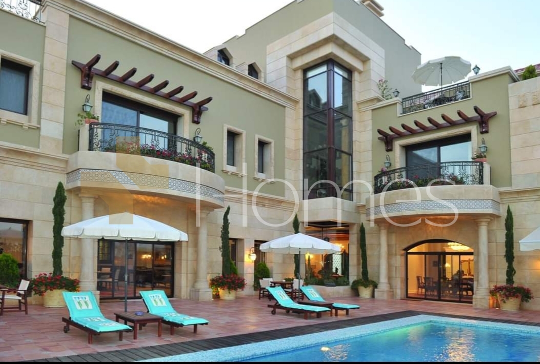 Villa with pool for sale in Al-Thuhair, with a built-up area of 2,000m