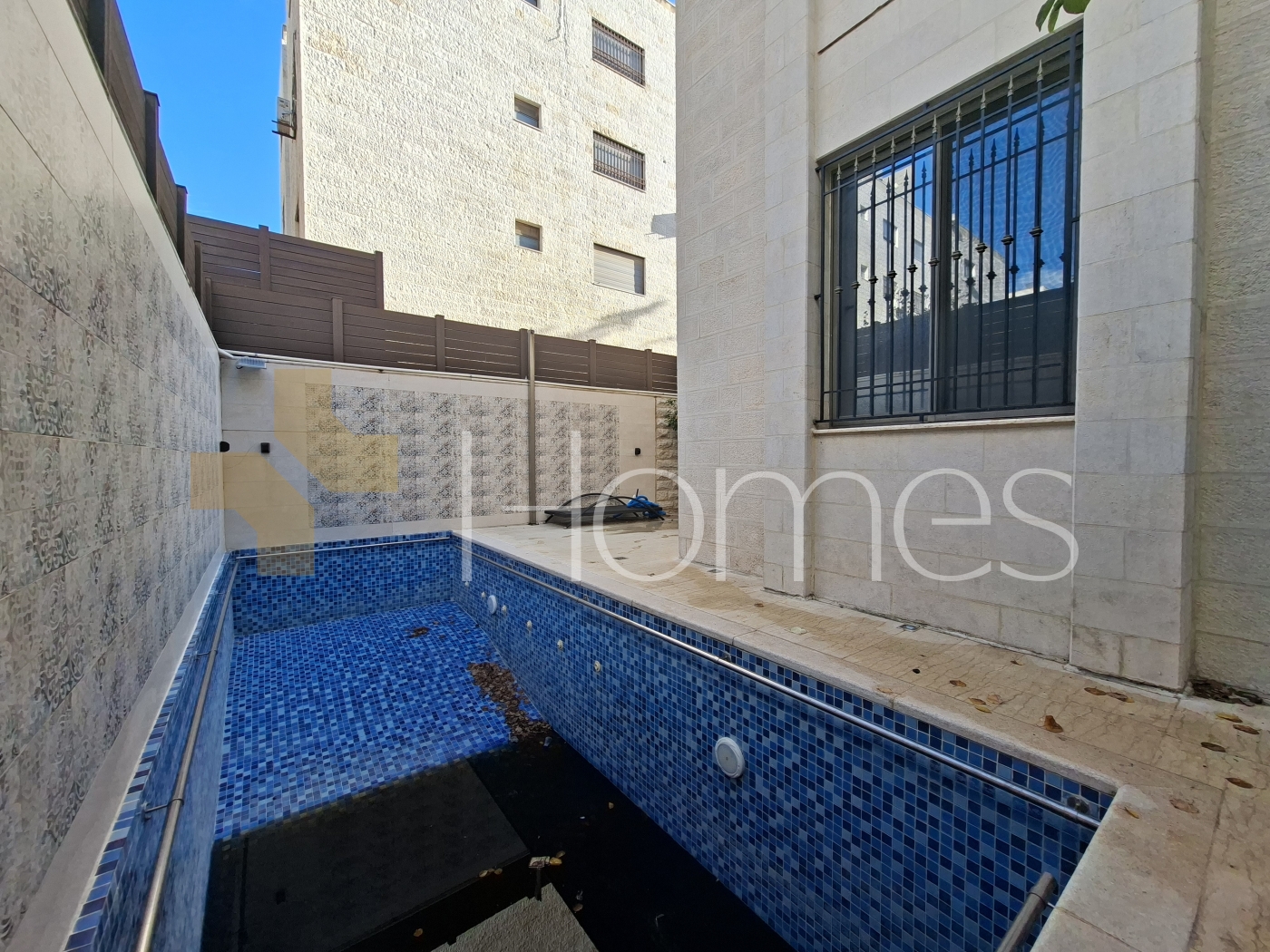 Villa with pool for sale in Qaryet Al Nakheel, building area of 1200m
