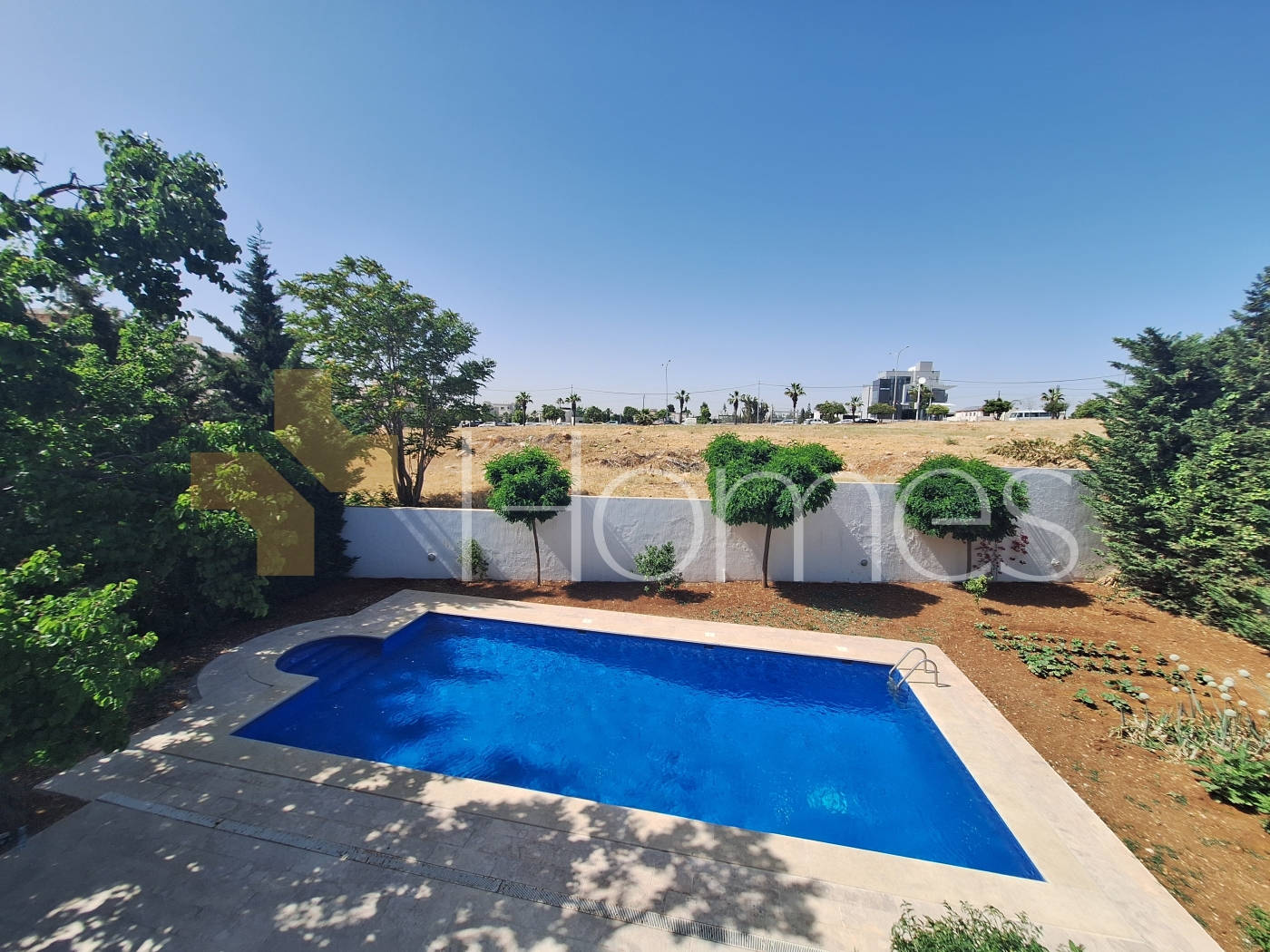 Attached villa with pool for sale in Abdoun, a building area of 600m