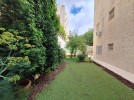 Ground floor apartment with a garden for rent in Khalda 360m