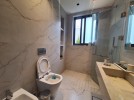 Ground floor apartment with a garden for rent in Khalda 250m