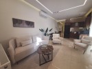 ground floor apartment with a terrace for rent in Deir Ghbar 95m