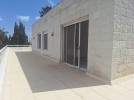Flat ground floor apartment with a roof for rent in Abdoun 550m 