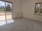 Flat ground floor apartment with a roof for rent in Abdoun 550m 