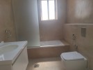 Flat ground floor apartment with a roof for rent in Abdoun 550m 