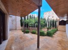 Ground floor apartment with garden for sale in Umm Al-Summaq 320m
