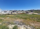Land for sale with high view in Rujm Omaish, with a land area of 930m.