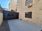 Ground floor apartments with a garden for sale in Khalda 204