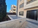 Ground floor apartments with a garden for sale in Khalda 204
