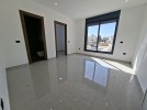 Ground floor with garden for sale in Qaryet AL-Nakheel, area of 240m