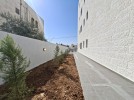 Ground floor with garden for sale in Qaryet AL-Nakheel, area of 240m