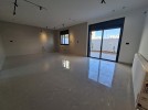 Ground floor with garden for sale in Qaryet AL-Nakheel, area of 240m