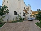 Standalone villa with pool for sale in Abdoun an area of 1160m