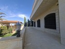 Villa with pool for sale in Umm Al Amad, with a Building area of 1400m