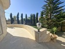 Villa with pool for sale in Umm Al Amad, with a Building area of 1400m