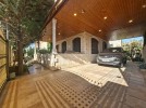 Villa with pool for sale in Umm Al Amad, with a Building area of 1400m