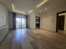 Apartment with terrace for sale in Qaryet Al-Nakheel, area of 210m