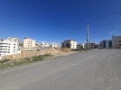 Land for sale with wide facade in Hai Al Sahaba, an area of 890m.