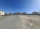 Land for sale with wide facade in Hai Al Sahaba, an area of 890m.