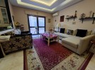 Furnished apartment with garden for sale in Qaryet Al-Nakheel, of 200m