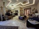 Furnished apartment with garden for sale in Qaryet Al-Nakheel, of 200m