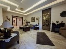 Furnished apartment with garden for sale in Qaryet Al-Nakheel, of 200m