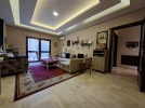 Furnished apartment with garden for sale in Qaryet Al-Nakheel, of 200m