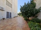 Furnished apartment with garden for sale in Qaryet Al-Nakheel, of 200m