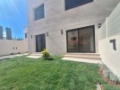Duplex ground floor apartment with garden for sale in Al-Kursi 210m