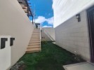 Duplex ground floor apartment with garden for sale in Al-Kursi 210m