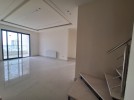Duplex apartment with a roof and terrace for sale in Umm Uthaina 180m