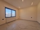 Flat ground floor apartment with a private garage for sale in Khalda
