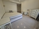 Attached villa with pool for sale in Abdoun, a building area of 745m