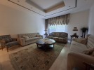 Attached villa with pool for sale in Abdoun, a building area of 745m