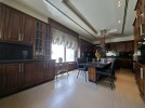 Attached villa with pool for sale in Abdoun, a building area of 745m