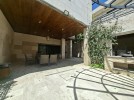 Attached villa with pool for sale in Abdoun, a building area of 745m