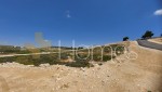ارض باطلالة عالية للبيع في طريق المطار على شارعين قرب مدارس الشويفات بمساحة 811م