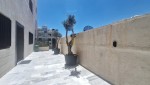 Ground floor apartment with a garden for sale in Umm Al Summaq