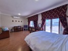 Attached villa for sale in Abdoun with a building area of 1015m