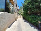 Attached villa for sale in Abdoun with a building area of 1015m