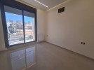 شقة اخير مع روف للبيع في دير غبار بمساحة بناء اجمالية 200م