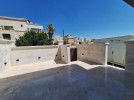 Duplex ground floor apartment with a garden for sale in Abdoun 412m