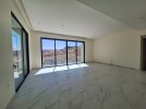 Flat ground floor apartment with a terrace for sale in Abdoun 392m