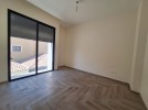 Flat ground floor apartment with a terrace for sale in Abdoun 392m