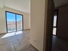 Flat ground floor apartment with a terrace for sale in Abdoun 392m