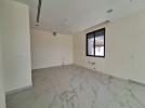 Flat ground floor apartment with a terrace for sale in Abdoun 392m