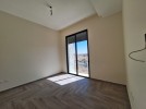 Flat ground floor apartment with a terrace for sale in Abdoun 392m