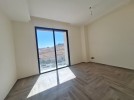 Flat ground floor apartment with a terrace for sale in Abdoun 392m