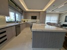 First-floor apartment for sale in Qaryet Al-Nakheel with a building area of 243m