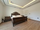 First-floor apartment for sale in Qaryet Al-Nakheel with a building area of 243m